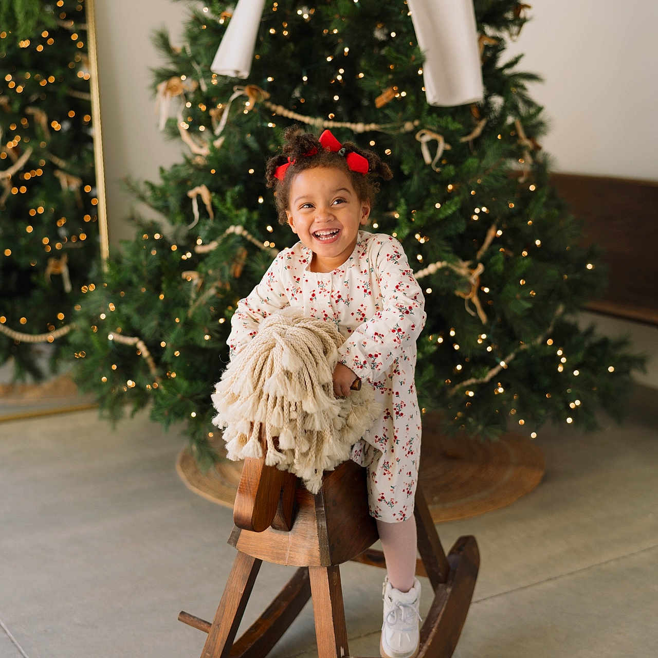 Paislee joined the competition — help win amazing prizes! child, christmas_tree, decorations, dress, festive_lights, floor, girl, holiday, indoor, joyful, mirror, play, portrait, red_bows, rocking_horse, smile, smiling, sneakers, wooden_furniture, wooden_toy