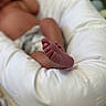 baby, blurred_background, child, closeup, comfort, cozy, cushion, diaper, foot, indoor, infant, newborn, relaxing, resting, seat, skin, small, soft, toes, white