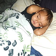 Joseph joined the competition — help win amazing prizes! child, toddler, sleeping, blanket, pillow, bed, face, eyelashes, arm, cute, cozy, indoor, animal_print, leaf_pattern, soft_texture, nap, peaceful, black_shirt, flash_photography, resting