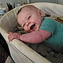 Cayden is registered to the contest to win money with this photo: baby, bassinet, smiling, happy, infant, blanket, bedroom, child, clothing, person, indoor, furniture, mesh, hand, face, head, laughing, young, cute, sleeping_area