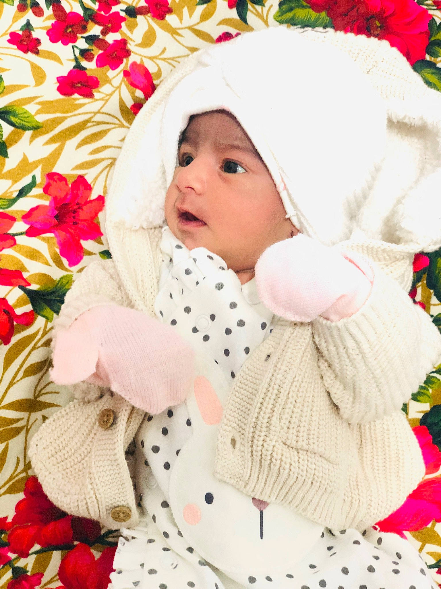 Dua is registered to the contest to win money with this photo: baby, baby_products, baby_sleeping, baby_toddler_clothing, cap, child, comfort, design, happy, head, headwear, linens, outerwear, pattern, person, petal, pink, skin, sleeve, textile