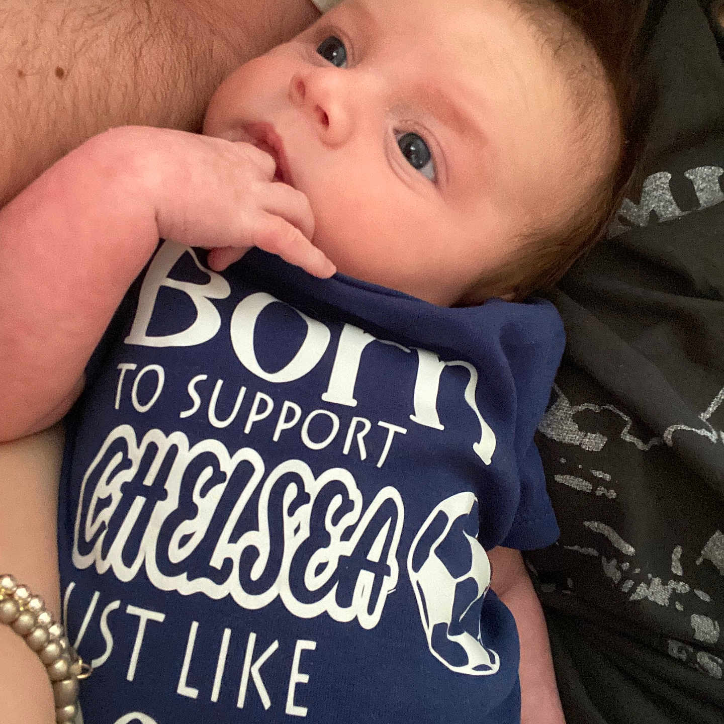 Lucas is registered to the contest to win money with this photo: accessories, baby, blanket, bracelet, clothing, couch, cushion, earring, face, furniture, head, homedecor, jewelry, necklace, newborn, pants, person, photography, portrait, t_shirt