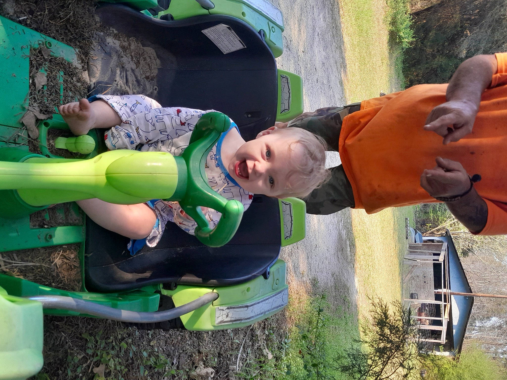 Aaliyah is registered to the contest to win money with this photo: baby, child, fictional_character, fun, grass, green, happy, joy, leisure, outdoor_play_equipment, person, personal_protective_equipment, plant, play, recreation, smile, toddler, water