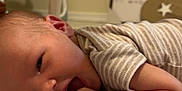 Weston is registered to the contest to win money with this photo: baby, infant, face, hand, blanket, toy, baby_swing, furniture, indoor, clothing, pattern, skin, sleeping, cute, child, newborn, head, mouth, home, decor