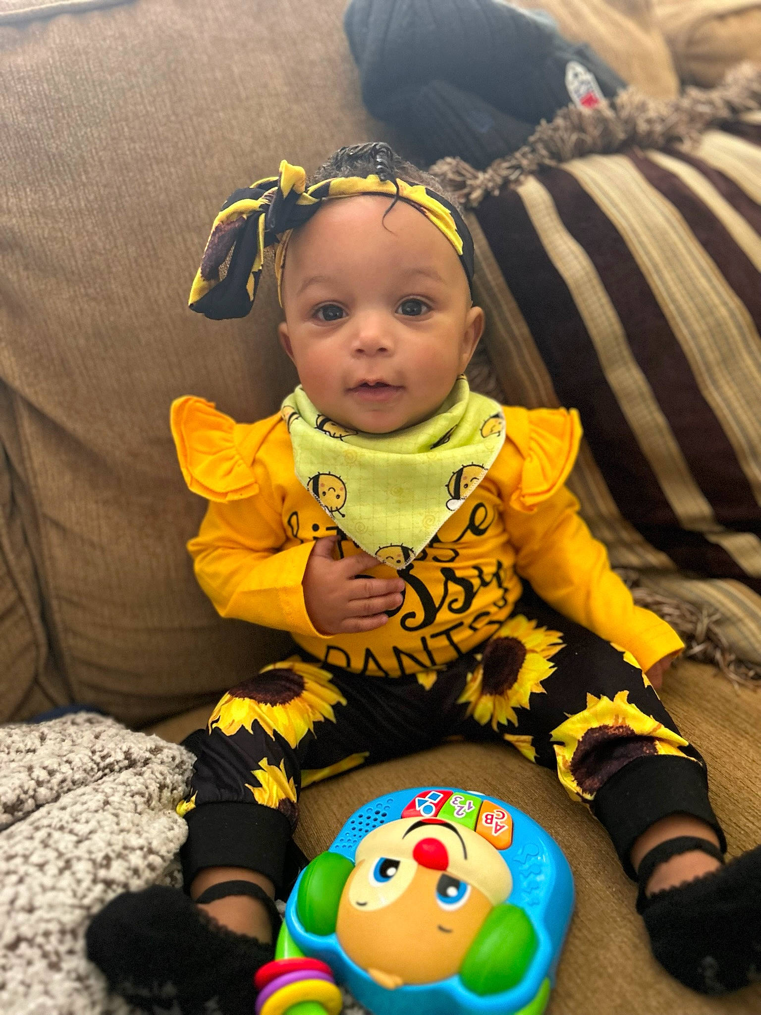 Ezekiah joined the competition — help win amazing prizes! baby, baby_products, baby_toddler_clothing, chair, cheek, child, comfort, dress, fun, grass, happy, lap, linens, mammal, people, person, product, sitting, sleeve, t_shirt