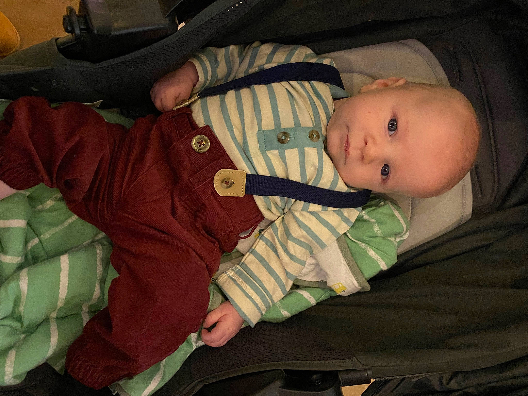Danny joined the competition — help win amazing prizes! baby, baby_carriage, baby_in_car_seat, baby_products, baby_toddler_clothing, car_seat, carmine, cheek, child, comfort, finger, human_body, lap, mammal, military_camouflage, mouth, person, product, sitting, sleeve