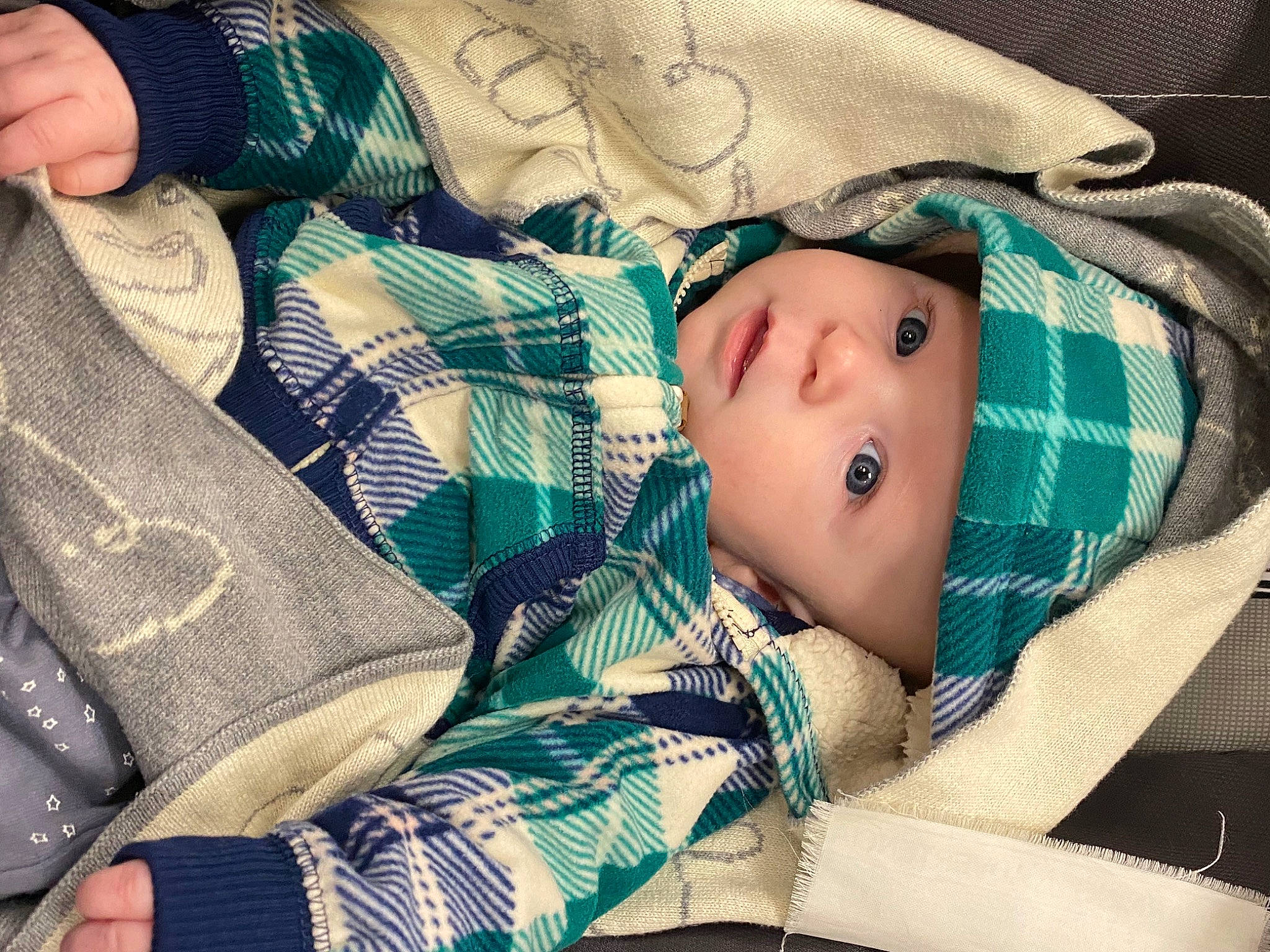 Danny joined the competition — help win amazing prizes! baby, baby_products, baby_toddler_clothing, cheek, child, comfort, couch, face, head, headwear, linens, nail, pattern, person, plaid, room, sitting, sleeve, tartan, thumb