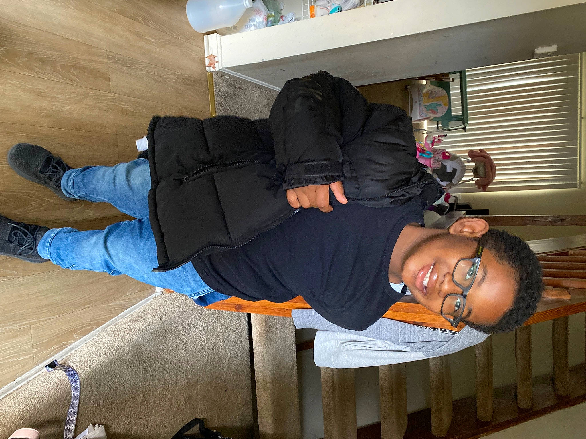 Aasad joined the competition — help win amazing prizes! comfort, elbow, flooring, fun, hardwood, hat, human_leg, joy, knee, lap, leg, person, room, sitting, smile, sportswear, thigh, white, window_blind, wood