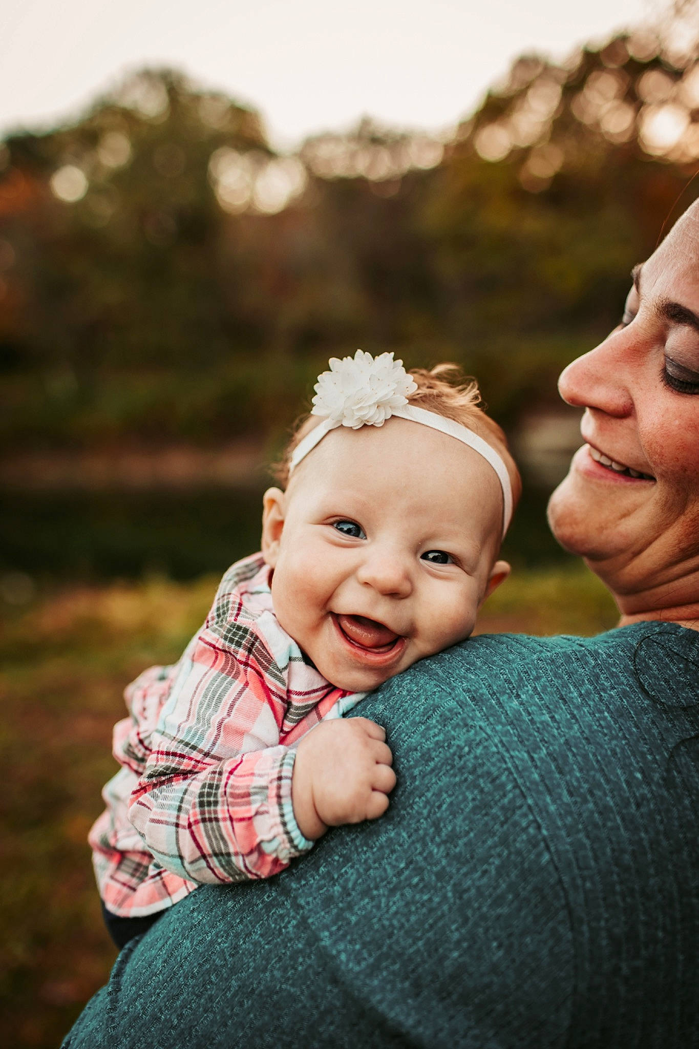 Eleanor is registered to the contest to win money with this photo: baby, baby_toddler_clothing, child, flash_photography, flower, fun, gesture, grass, happy, laugh, pattern, people_in_nature, person, plant, portrait, portrait_photography, skin, sky, smile, toddler