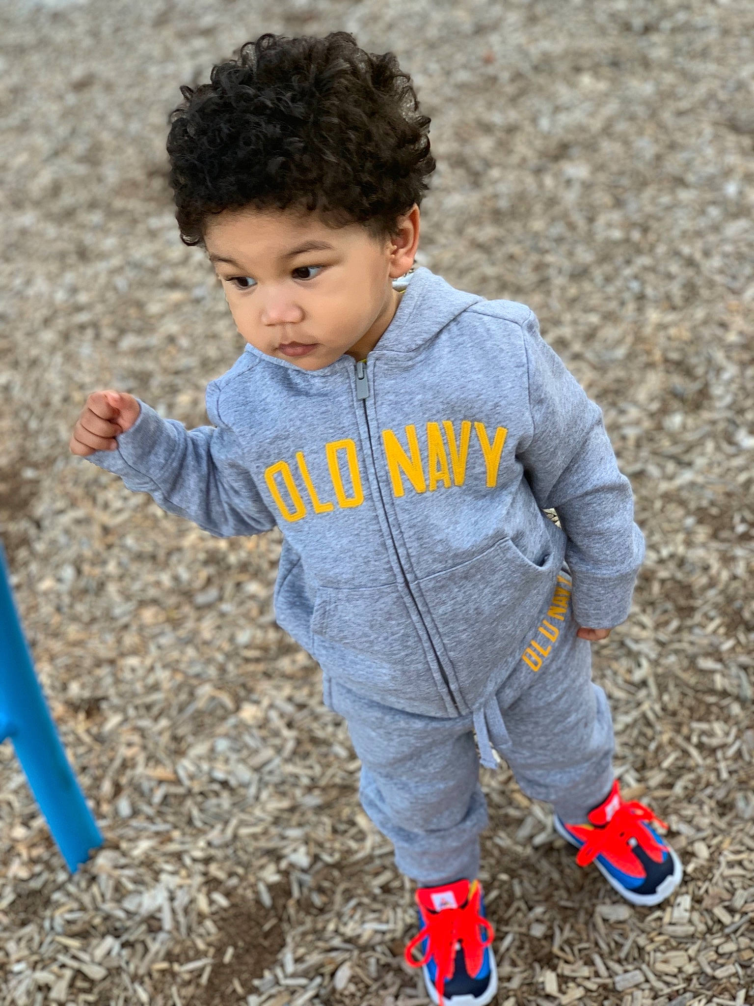 Hassan joined the competition — help win amazing prizes! baby, child, fun, jacket, outerwear, person, plant, play, sleeve, smile, standing, t_shirt, toddler