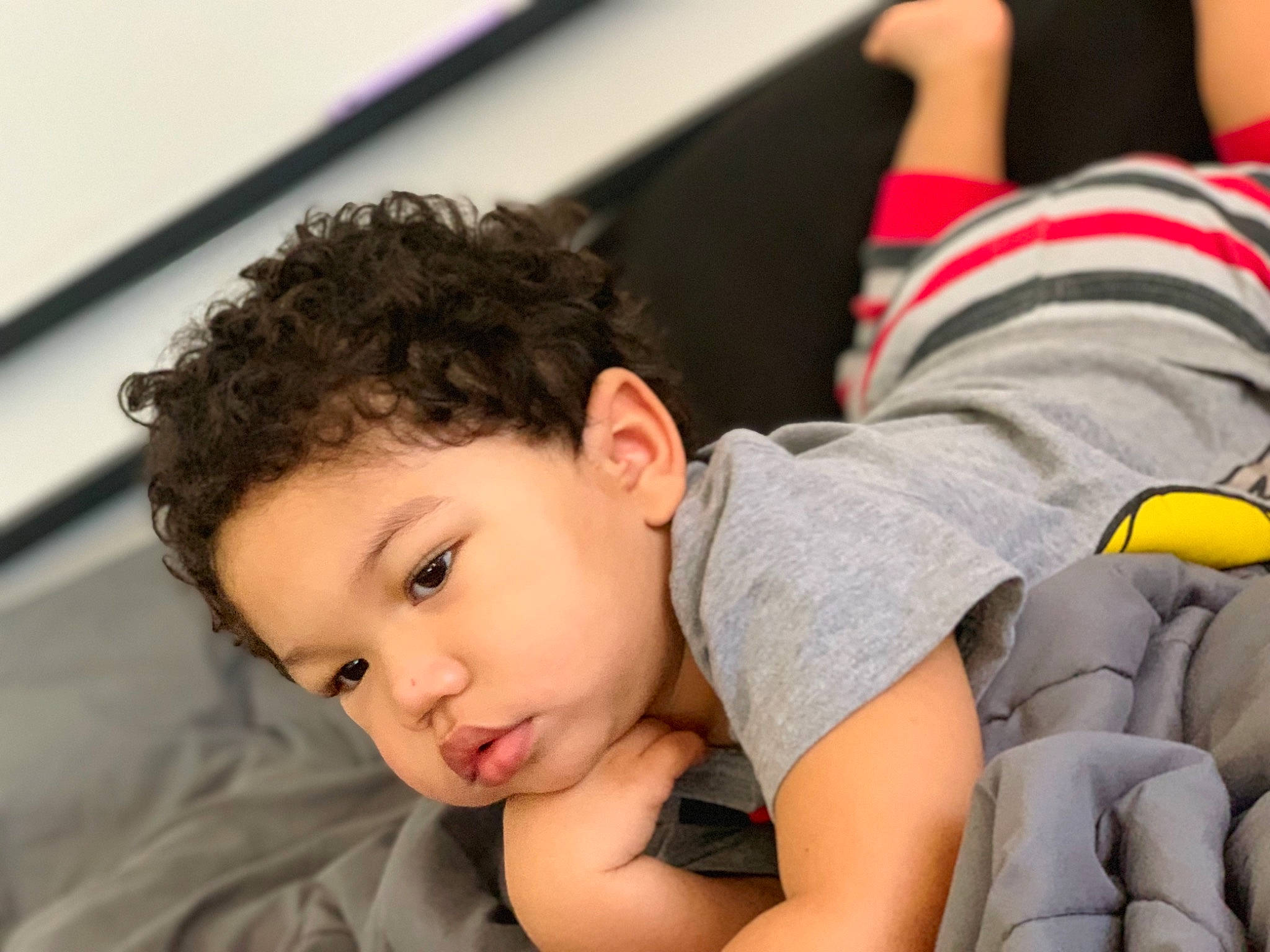 Hassan is registered to the contest to win money with this photo: arm, baby, child, nap, person, play, sleep, toddler