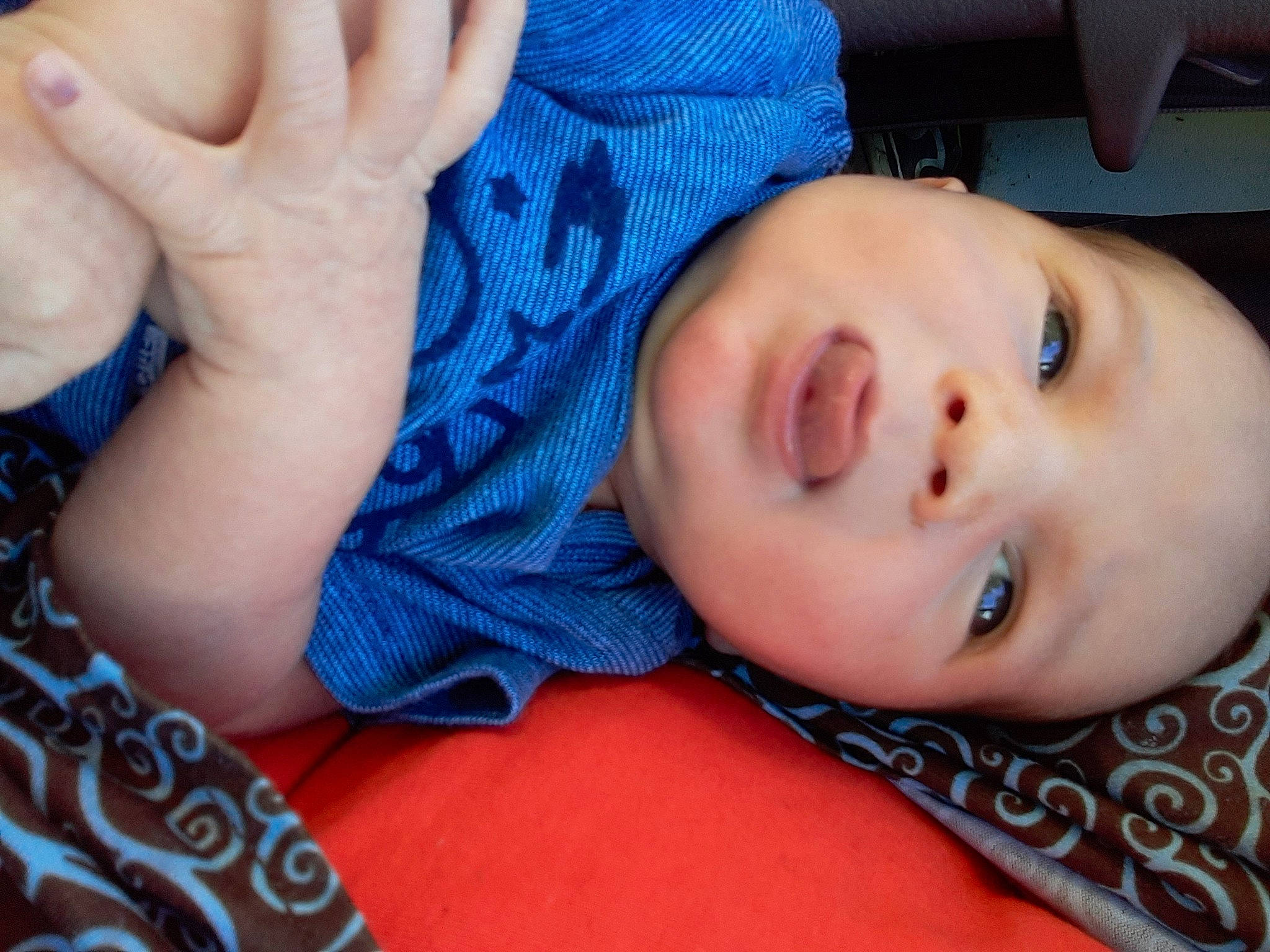 Marvin is registered to the contest to win money with this photo: baby, blue, cheek, child, chin, close_up, eye, eyebrow, face, finger, forehead, hand, head, iris, lip, mouth, neck, nose, person, skin