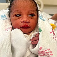 Toussaint joined the competition — help win amazing prizes! newborn, baby, infant, child, portrait, face, eyes, hospital, blanket, swaddled, white_clothing, hand, adult_hand, indoors, close_up, awake, cozy, head, photography, family