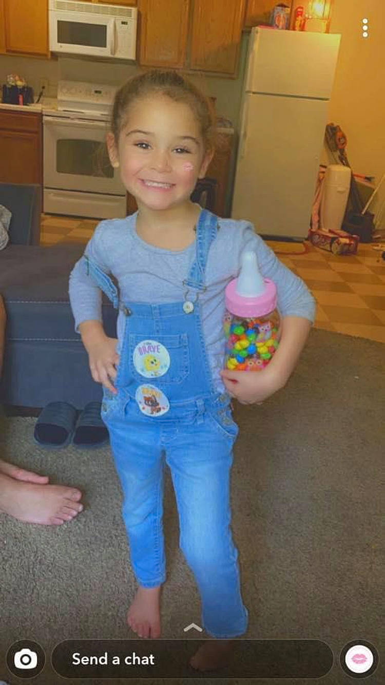 Diamond is registered to the contest to win money with this photo: baby_toddler_clothing, cabinetry, chair, child, drawer, electric_blue, flooring, fun, head, home_appliance, joy, kitchen_appliance, microwave_oven, party, party_supply, person, play, room, smile, t_shirt