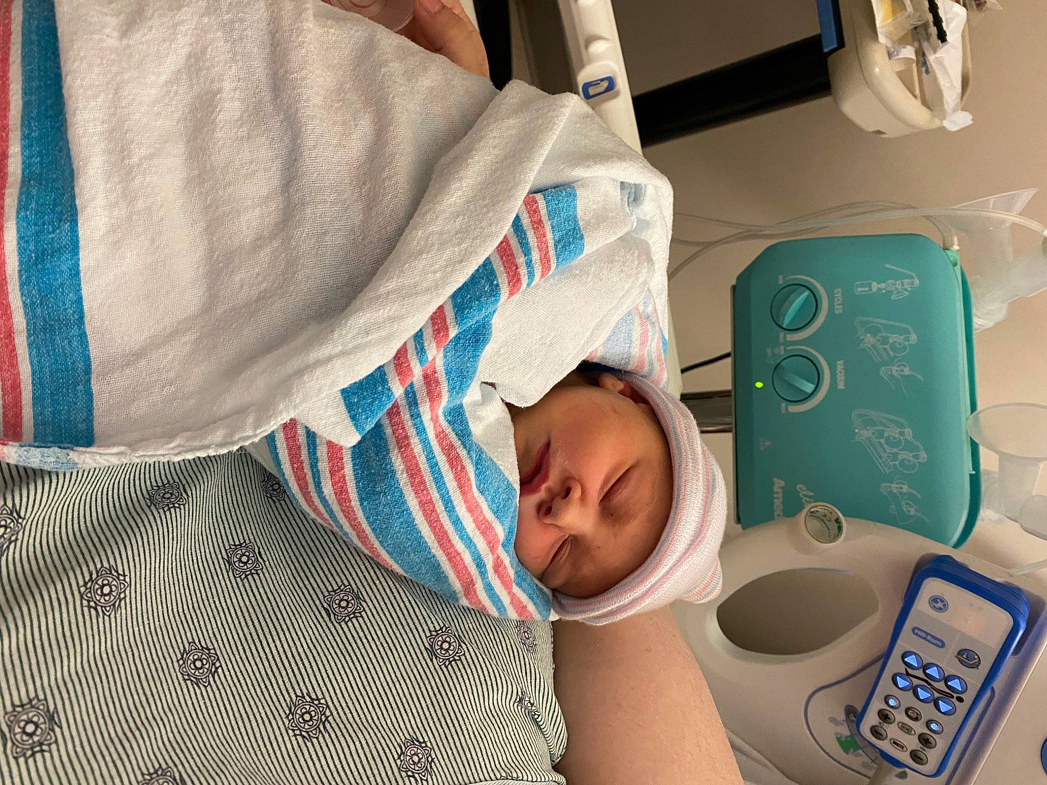 Allison is registered to the contest to win money with this photo: baby, baby_toddler_clothing, bedtime, book, child, comfort, font, hat, headwear, input_device, linens, nap, office_equipment, pattern, person, plaid, publication, reading, room, table