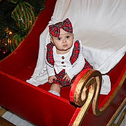 Melaiya joined the competition — help win amazing prizes! baby, bow, celebration, child, christmas_tree, cute, decorations, festive, holiday, indoor, infant, penguin, plaid, red, seasonal, sleigh, stuffed_animal, toy, white, winter