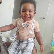 Bobby joined the competition — help win amazing prizes! toddler, child, smiling, indoor, plaid, bow_tie, suspenders, person, cute, happy, clothing, baby, short_sleeve, holding, adult, door, room, furniture, floor, light_switch