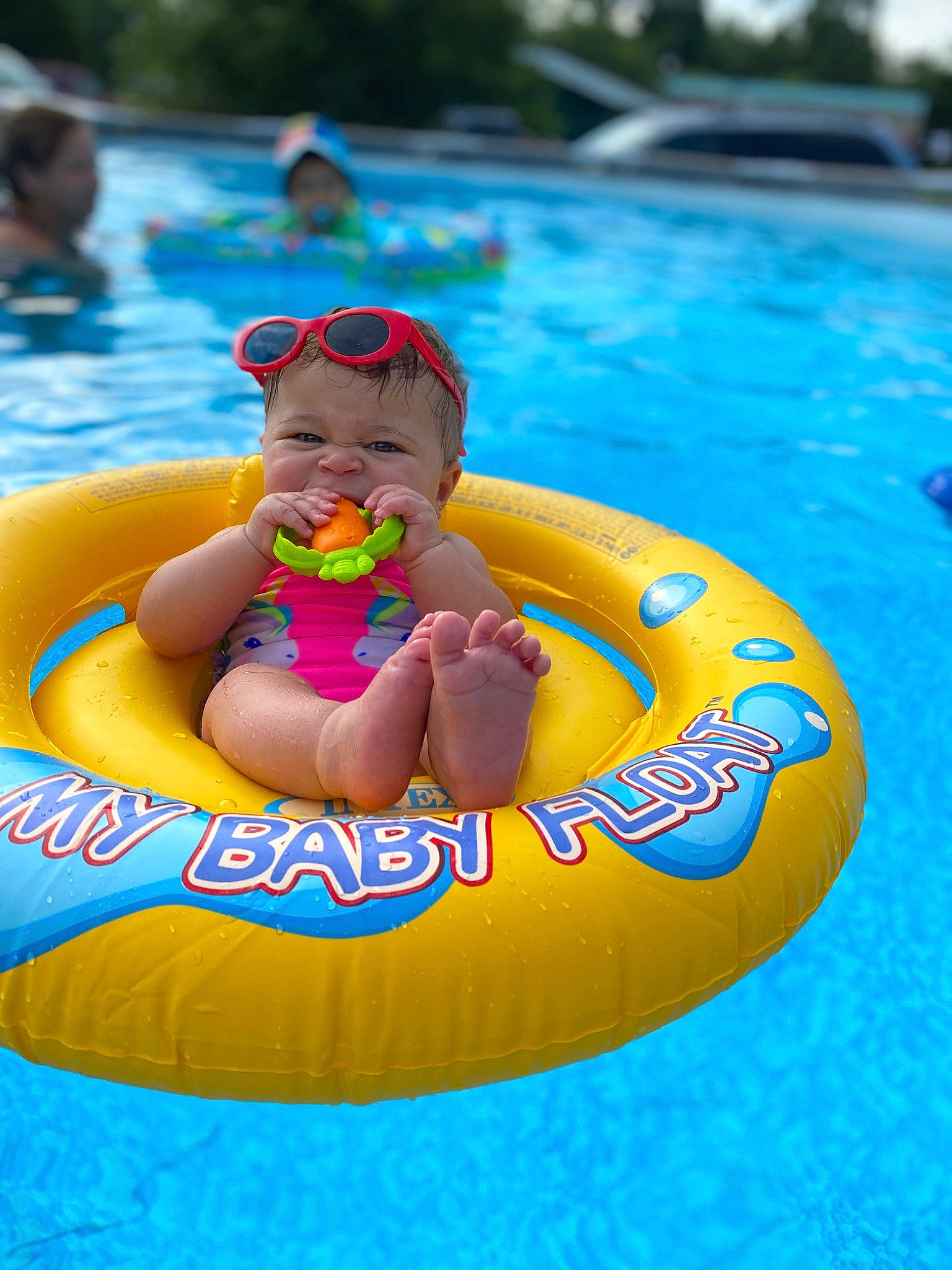 Nina is registered to the contest to win money with this photo: aqua, baby, baby_float, bathing, child, fun, games, happy, inflatable, leisure, nonbuilding_structure, outdoor_recreation, person, personal_protective_equipment, play, product, recreation, swimming_pool, toddler, tubing