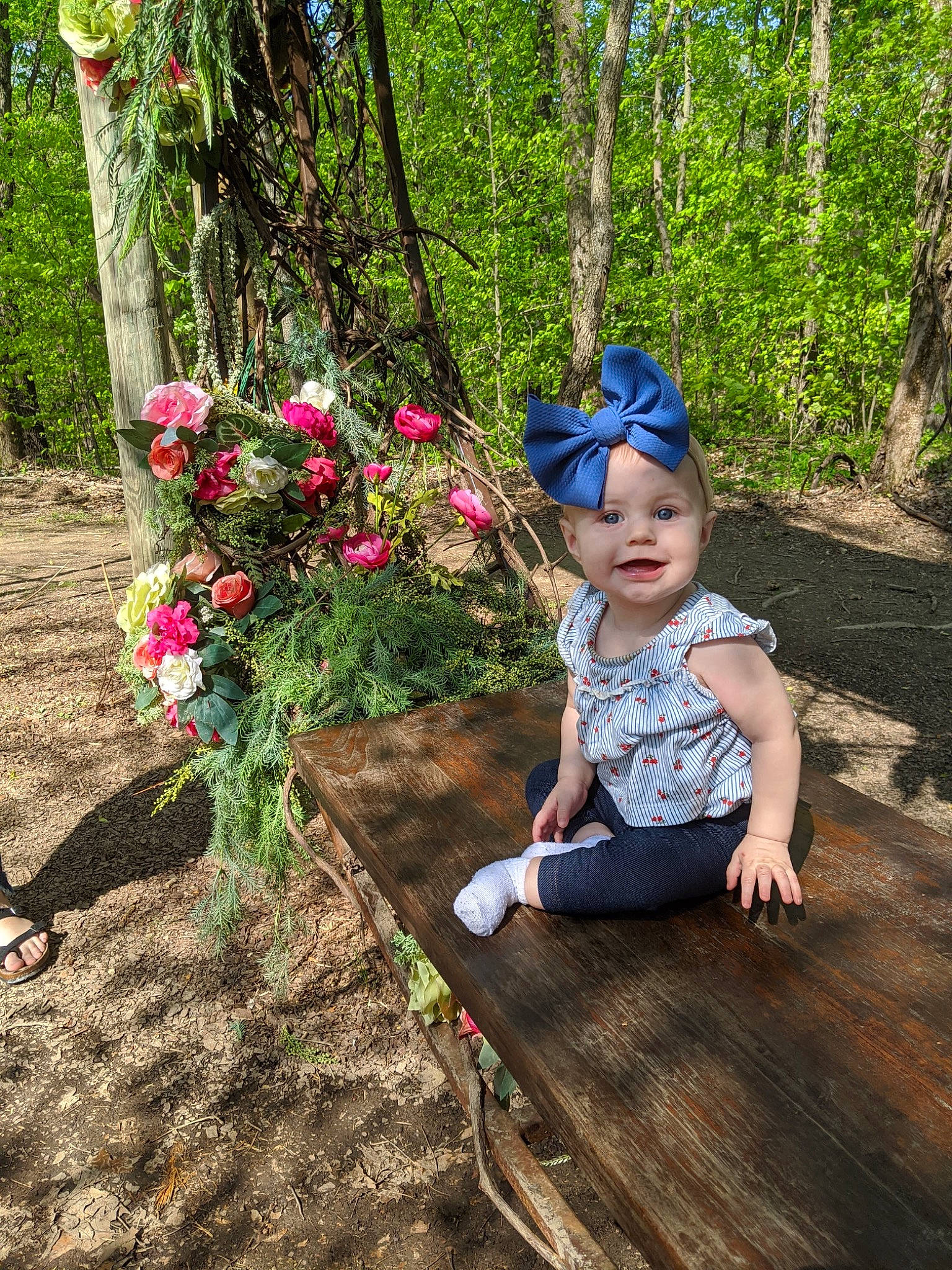 Annabelle joined the competition — help win amazing prizes! botany, child, fawn, flower, forest, headwear, joy, person, plant, sitting, spring, terrestrial_plant, toddler, tree, vacation, wildflower