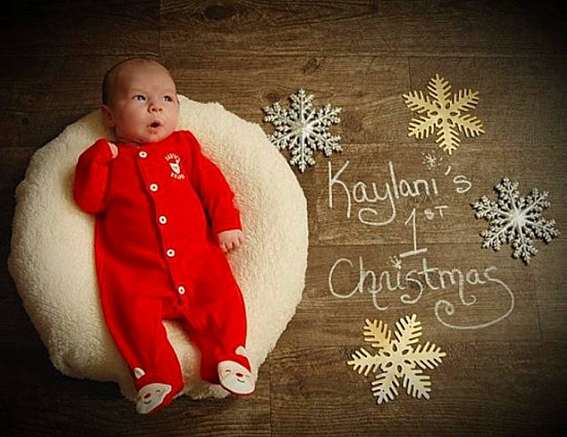 Kaylani joined the competition — help win amazing prizes! baby, baby_toddler_clothing, christmas, christmas_eve, costume_accessory, embellishment, fictional_character, greeting_card, holiday, pattern, person, snowflake