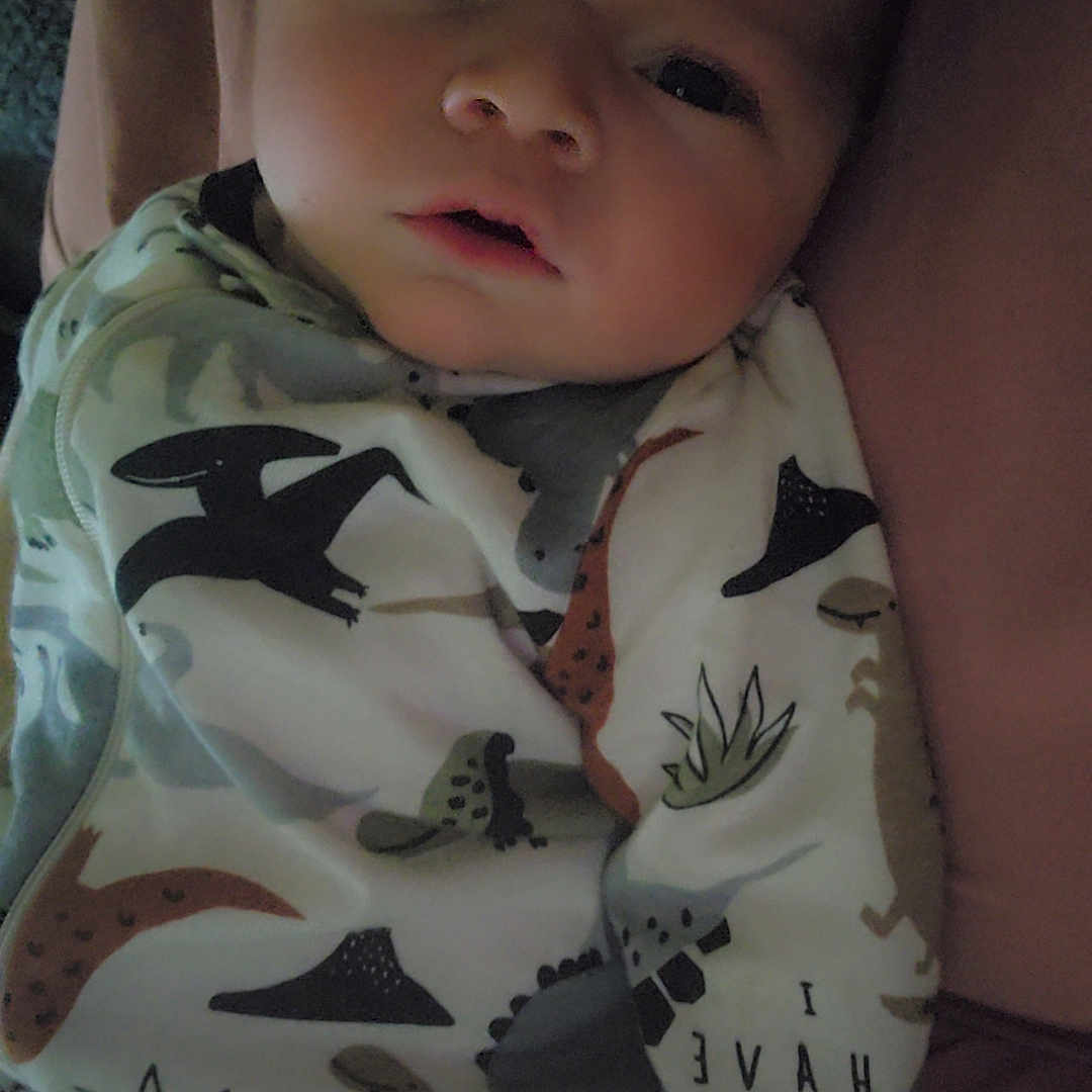 Oliver is registered to the contest to win money with this photo: baby, blanket, bodypart, bonnet, clothing, dress, face, finger, hand, hat, head, hood, hoodie, knitwear, newborn, person, photography, portrait, sweater, sweatshirt