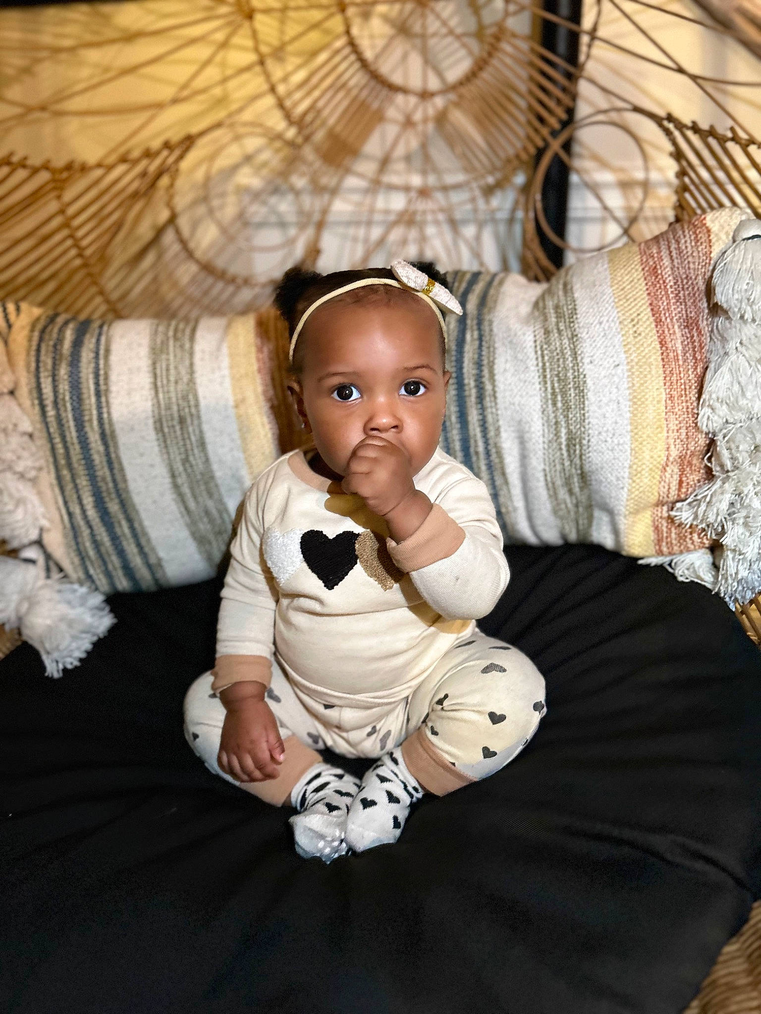 Jupiter is registered to the contest to win money with this photo: baby, baby_toddler_clothing, bedding, carpet, child, comfort, eye, fashion_accessory, flash_photography, flooring, foot, fun, fur, head, linens, pattern, person, room, sitting, toddler