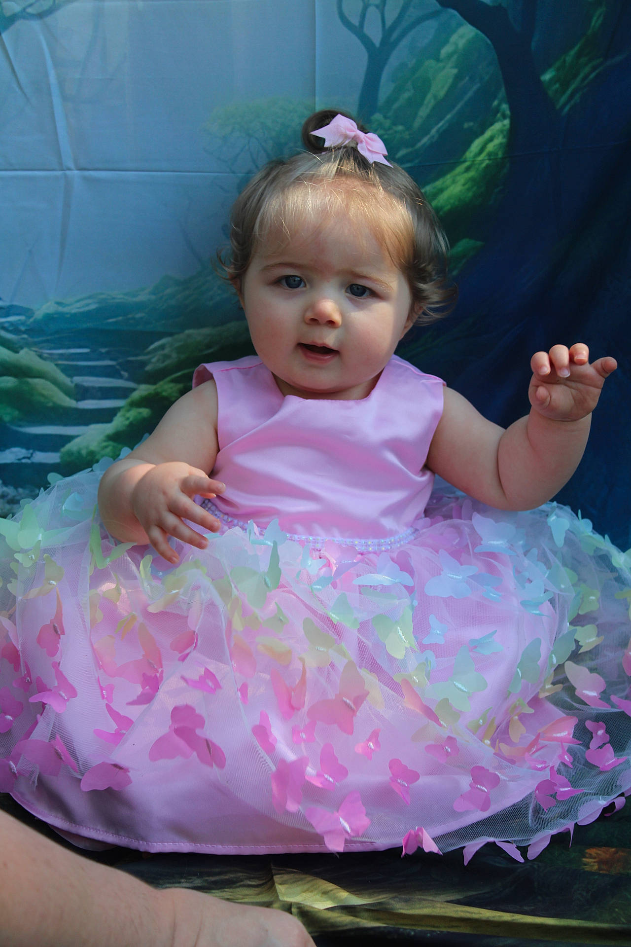 Addison is registered to the contest to win money with this photo: baby, bodypart, clothing, costume, dress, eveningdress, face, fashion, finger, flower, formalwear, gown, hand, head, pattern, person, photography, plant, portrait, sitting