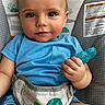 Mason joined the competition — help win amazing prizes! baby, infant, child, portrait, smiling, sitting, blue_shirt, teether, toy, diaper, turtle_design, chair, car_seat, indoor, close_up, face, eyes, blonde_hair, happy, safe