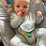 Mason joined the competition — help win amazing prizes! baby, baby_gear, bib, blanket, bouncer, child, clothing, colorful, cushion, face, fist, hands, happy, home, indoor, infant, portrait, sitting, smiling, toy