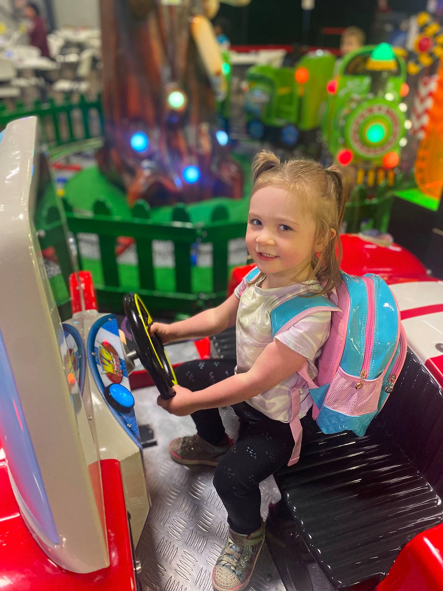 Aubree Hunt joined the competition — help win amazing prizes! arcade_game, audio_equipment, automotive_design, bumper, child, entertainment, event, fun, green, happy, joy, leisure, machine, motor_vehicle, person, play, recreation, sandal, smile, snapshot