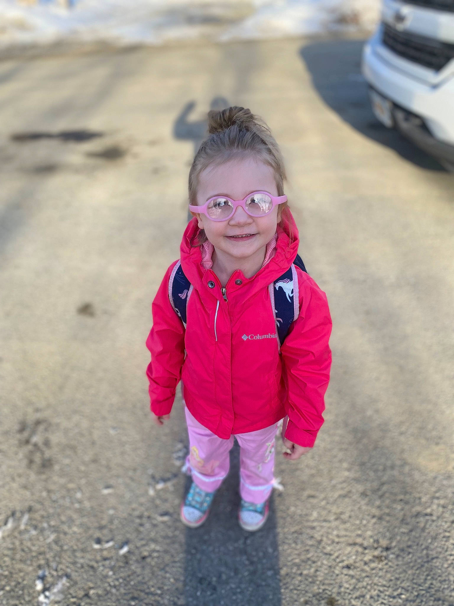 Aubree Hunt joined the competition — help win amazing prizes! asphalt, automotive_exterior, automotive_tire, eye, eyewear, face, fun, grass, happy, head, jacket, joy, landscape, leisure, motor_vehicle, person, road, road_surface, smile, toddler
