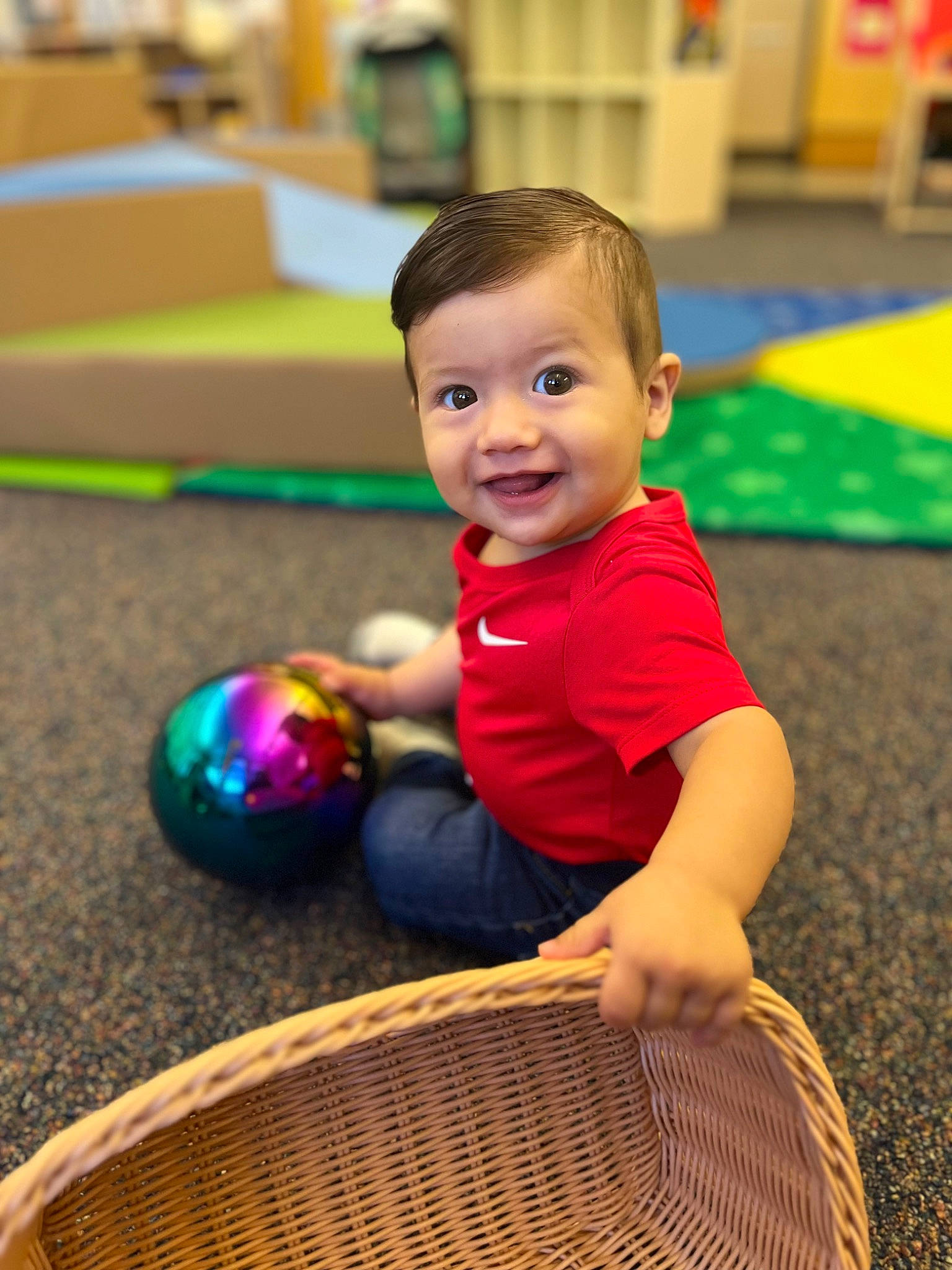 Enrique joined the competition — help win amazing prizes! baby, baby_playing_with_toys, ball, child, event, facial_expression, flooring, fun, grass, happy, human, joy, leisure, person, play, recreation, sitting, skin, smile, toddler
