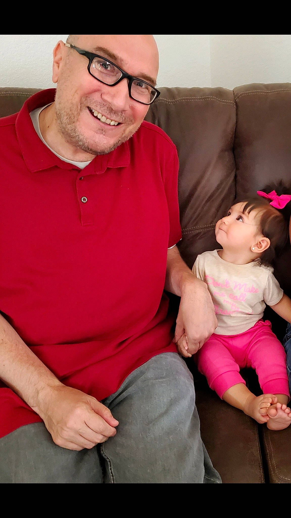 Juanita Racheal is registered to the contest to win money with this photo: abdomen, arm, child, grandparent, headwear, joy, lap, leg, person, pink, sitting, toddler