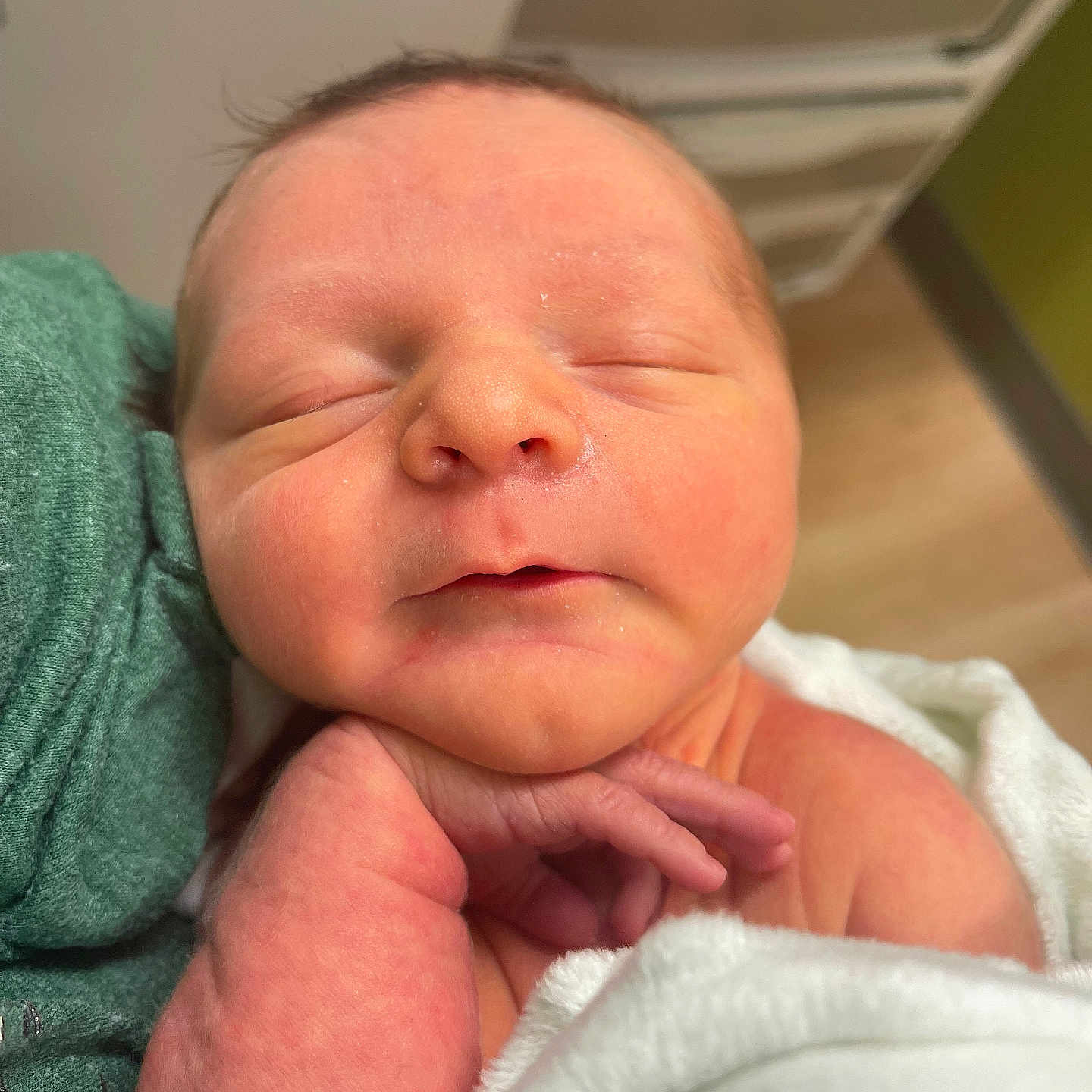 Elijah is registered to the contest to win money with this photo: architecture, baby, blanket, bodypart, building, face, finger, hand, head, hospital, newborn, person, photography, portrait, sleeping, towel