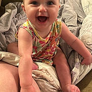 Ariel joined the competition — help win amazing prizes! baby, babylaughing, bodypart, clothing, couch, cushion, face, finger, furniture, hand, happy, head, homedecor, laughing, person, photography, portrait, shorts, sitting, smile