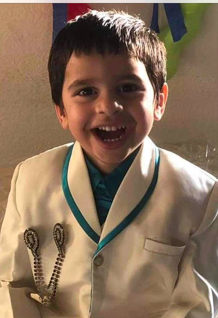 Arnav is registered to the contest to win money with this photo: blazer, child, collar, dress_shirt, eye, formal_wear, fun, glove, gold_medal, hair, hairstyle, happy, joy, laugh, medal, outerwear, person, school_uniform, sleeve, smile