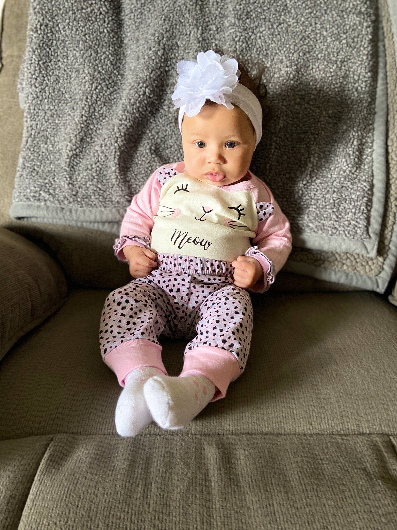 Ashlynn is registered to the contest to win money with this photo: baby, baby_products, baby_toddler_clothing, child, crochet, headgear, knitting, pattern, person, pink, product, sitting, skin, toddler