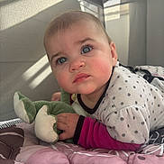 Lénah Rosa participe au concours pour gagner de l'argent avec cette photo : baby, infant, blue_eyes, plush_toy, playpen, blanket, quilt, soft_toys, indoor, child, cute, curious, face, clothing, pajamas, bedroom, sunlight, portrait, close_up, resting