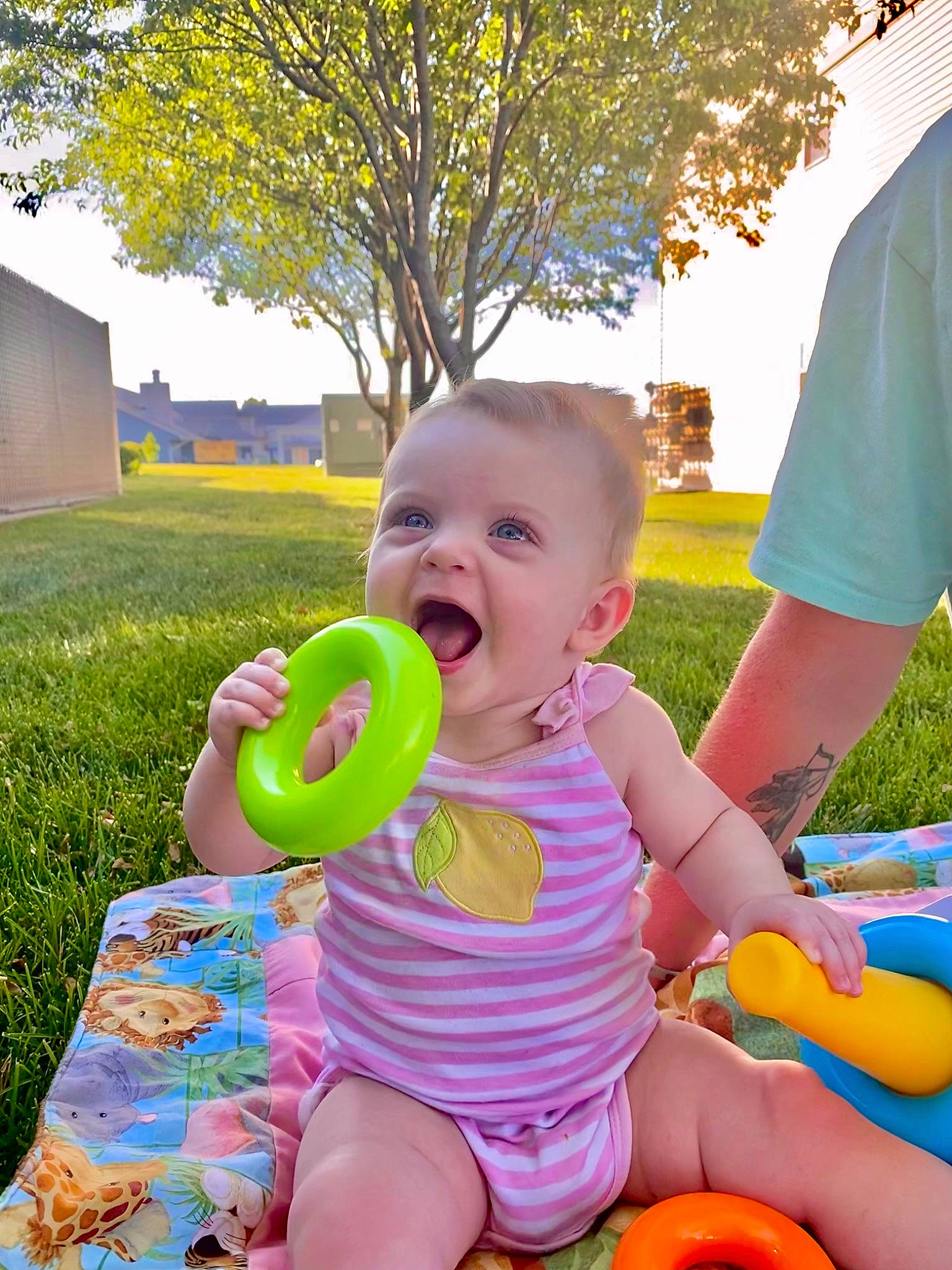 Waverly is registered to the contest to win money with this photo: baby, baby_playing_with_toys, baby_toddler_clothing, blue, grass, green, happy, leisure, people_in_nature, person, photograph, pink, plant, public_space, skin, sky, smile, sunlight, toddler, tree