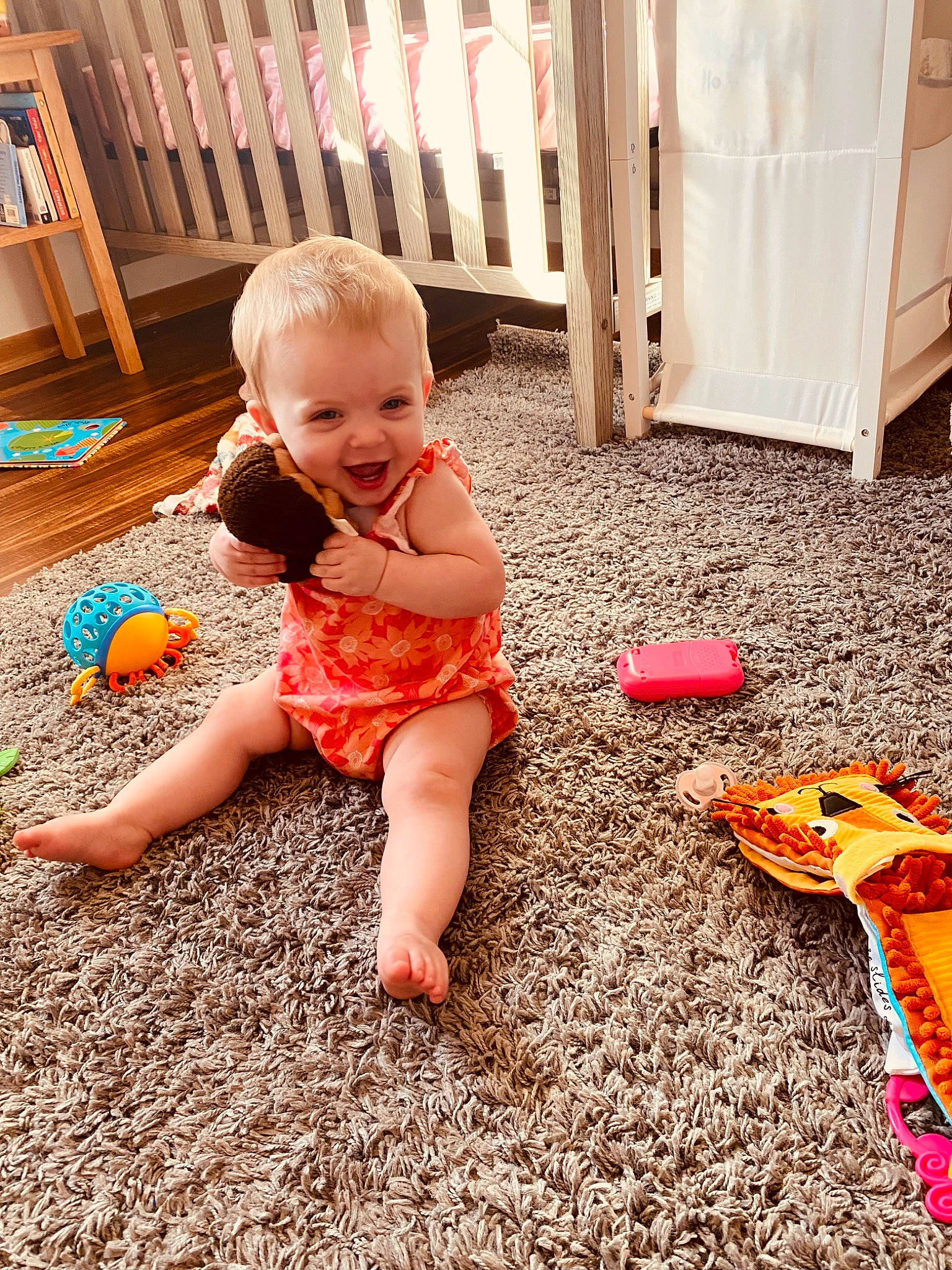 Waverly is registered to the contest to win money with this photo: baby, baby_toddler_clothing, barefoot, child, floor, flooring, foot, fun, grass, happy, human_leg, leg, leisure, orange, people_in_nature, person, sitting, smile, thigh, toddler