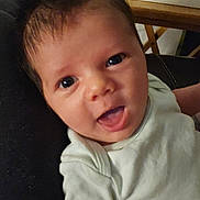 Lukas is registered to the contest to win money with this photo: baby, infant, face, smile, eyes, clothing, indoor, person, happy, cute, child, closeup, young, skin, hair, mouth, expression, sitting, furniture, background