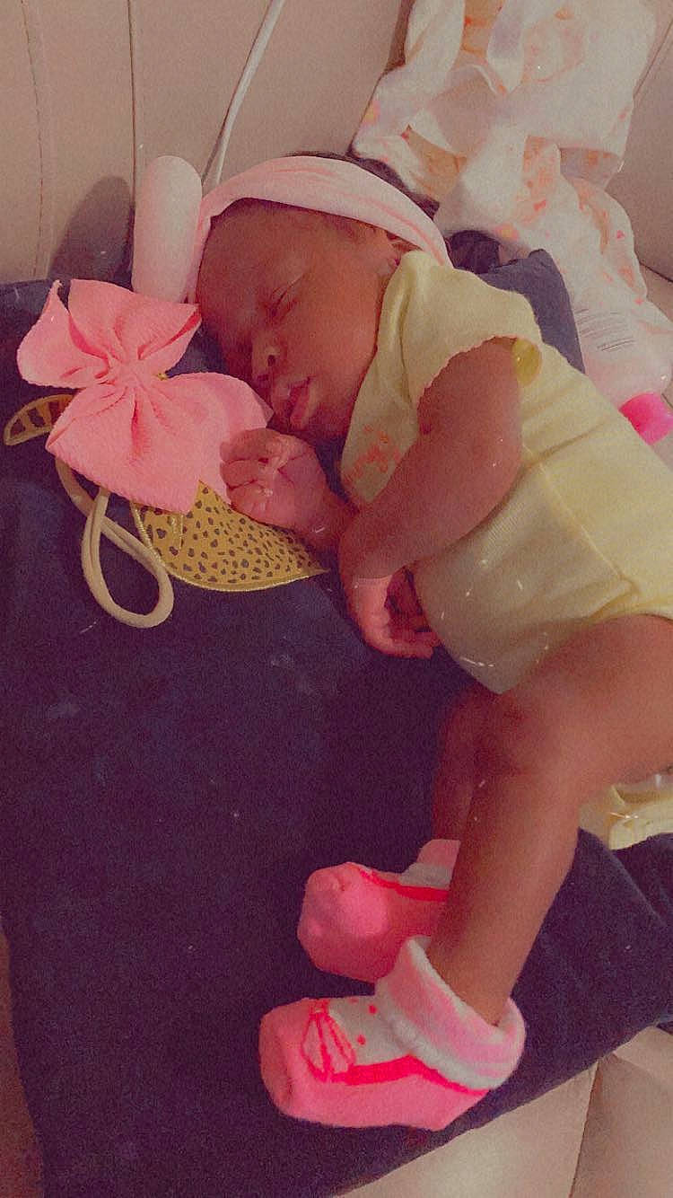 Tuuts is registered to the contest to win money with this photo: baby, baby_sleeping, baby_toddler_clothing, child, comfort, costume_hat, foot, happy, hat, human_leg, leg, magenta, nail, peach, person, petal, pink, skin, thigh, toddler