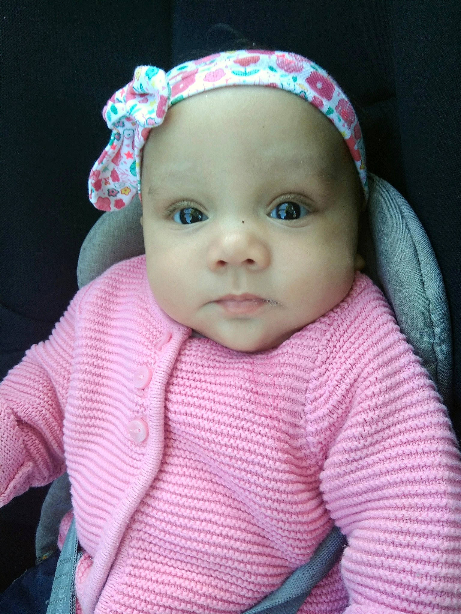 Alma participe au concours pour gagner de l'argent avec cette photo : baby, cheek, child, doll, eye, face, forehead, hair_accessory, head, headgear, headwear, iris, knitting, lip, outerwear, person, pink, skin, toddler, toy