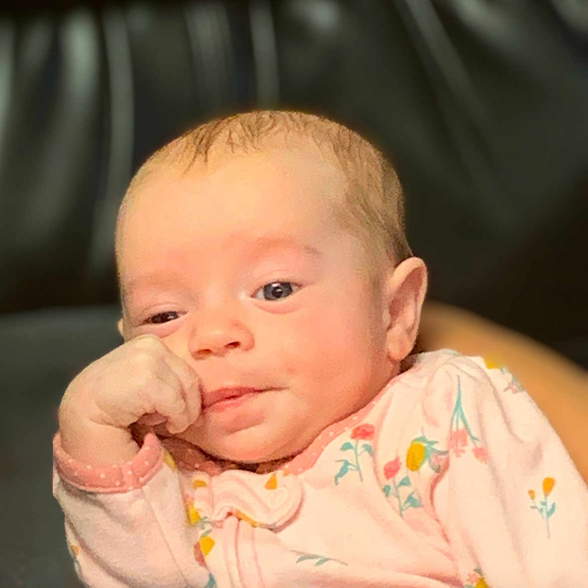 Emma is registered to the contest to win money with this photo: baby, bodypart, face, finger, frown, hand, head, newborn, person, photography, portrait, sad
