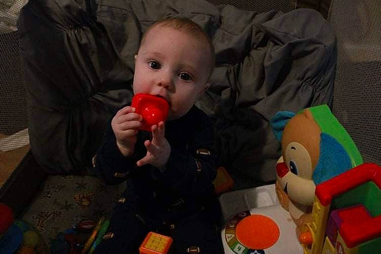 Jiraiya is registered to the contest to win money with this photo: arm, baby, chair, cheek, child, comfort, event, face, facial_expression, finger, fun, human_body, mouth, nose, orange, person, room, sitting, skin, toddler