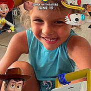 Lucy is registered to the contest to win money with this photo: animated_characters, animation, blonde_hair, blue_shirt, buzz_lightyear, child, closeup, colorful, digital_overlay, dolly, duke_caboom, forky, happy, indoor, jessie, movie_promotion, playful, smiling, toy_story, woody