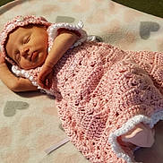 Ava is registered to the contest to win money with this photo: art, baby, baby_toddler_clothing, bonnet, child, craft, crochet, headgear, knitting, linens, outerwear, pattern, pink, textile, wool