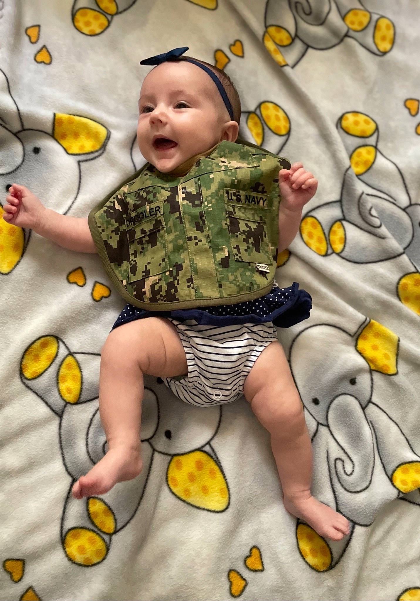 Everest joined the competition — help win amazing prizes! arm, art, baby, baby_toddler_clothing, child, facial_expression, fictional_character, finger, flooring, fun, happy, human_body, mammal, pattern, people_in_nature, person, smile, textile, toddler, vertebrate