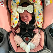 Calianne joined the competition — help win amazing prizes! baby, newborn, car_seat, safety_harness, sleeping, bow, floral_pattern, pink, white_socks, infant, child, cute, peaceful, soft_toys, fabric, seat_cushion, indoors, portrait, resting, child_seat