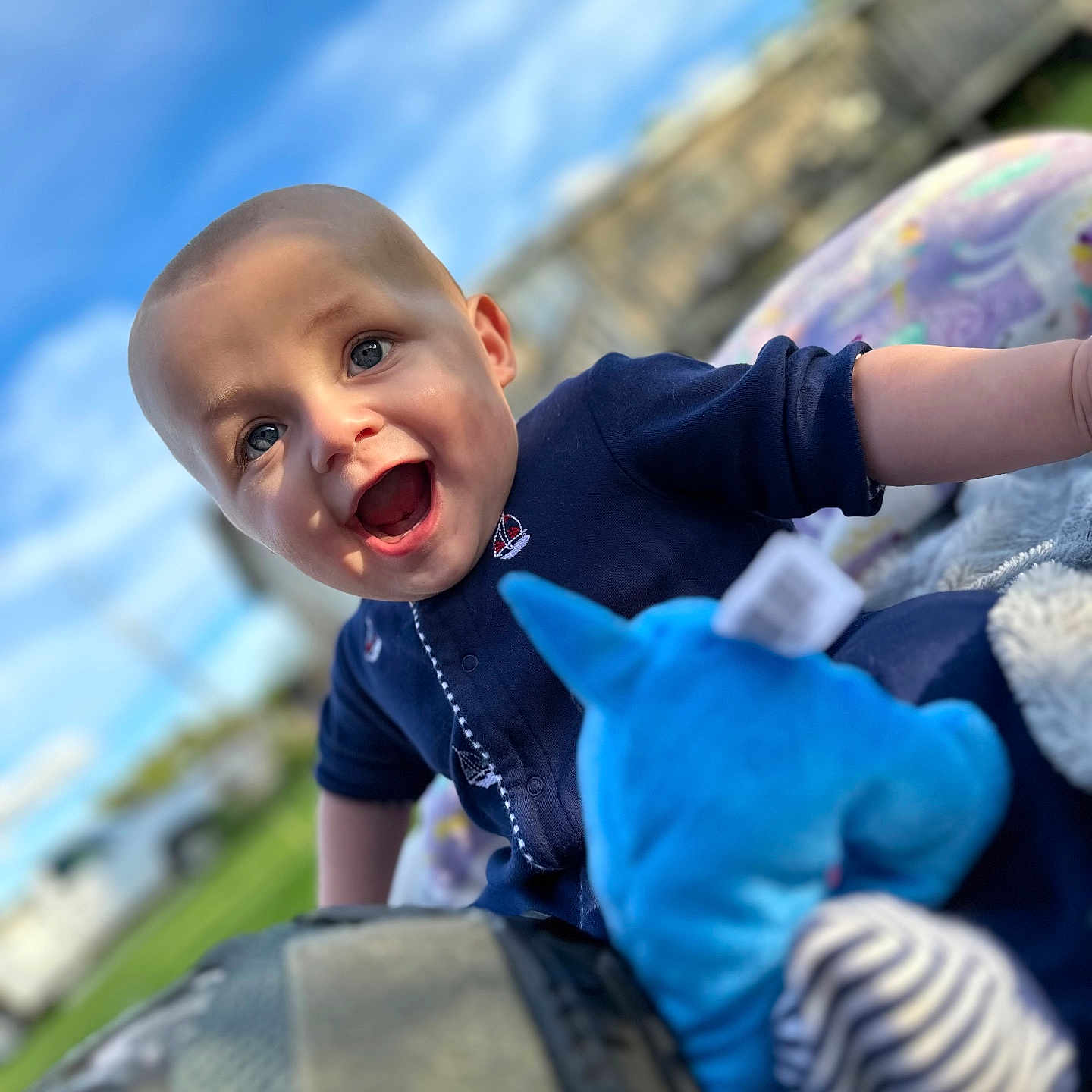 Declan is registered to the contest to win money with this photo: baby, babylaughing, bodypart, clothing, face, finger, glove, hand, happy, head, laughing, mouth, pants, person, photography, portrait, smile, t_shirt, teeth, toy